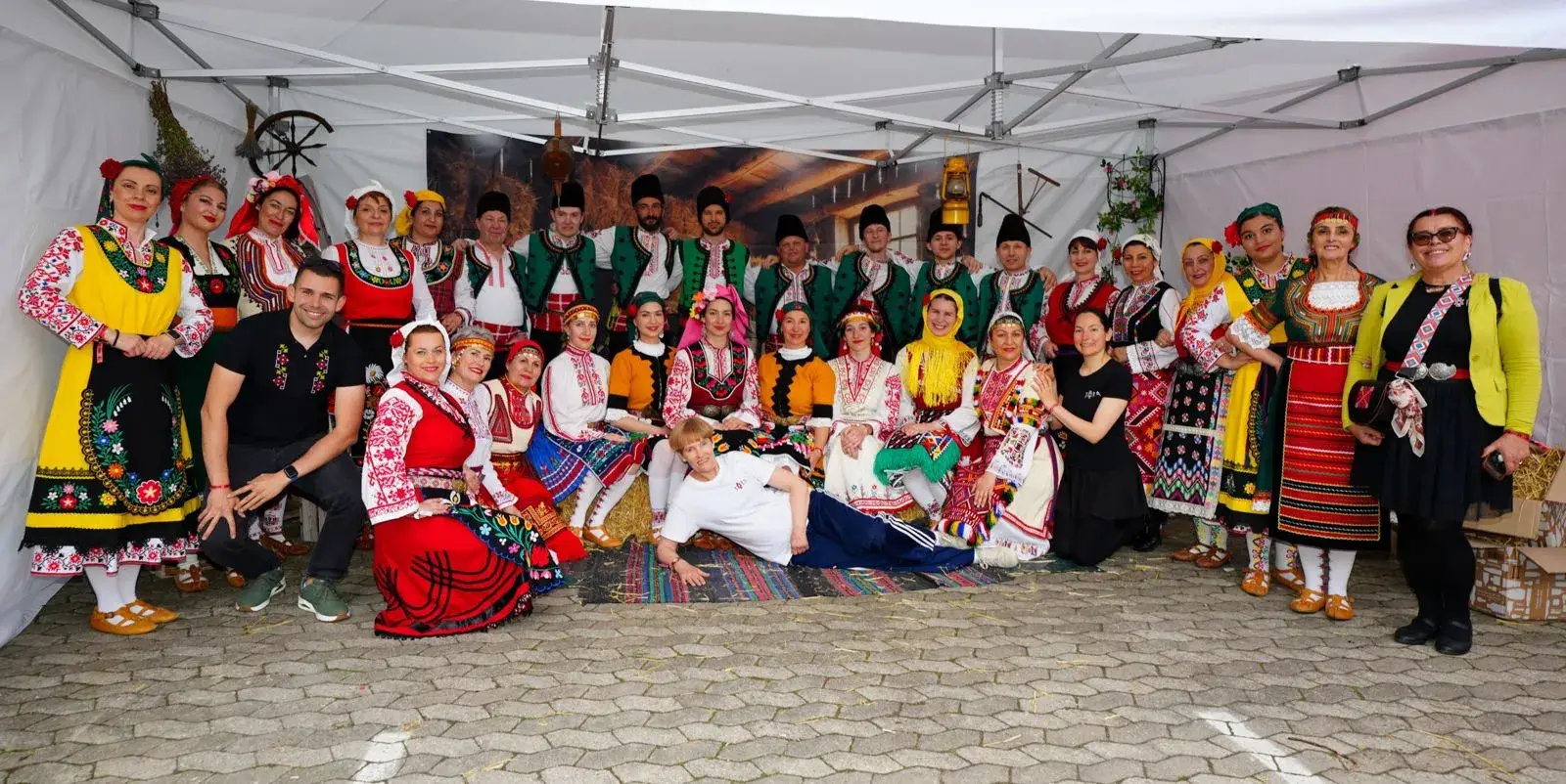 Zora dancers in traditional Bulgarian costume, smiling together